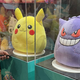 Pikachu and Gengar Squishmallows sit in display cases.